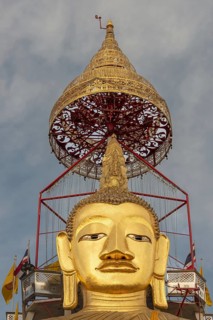 32 metre high standing Buddha decorated with glass mosaics and 24 carat gold, the upper knot of the