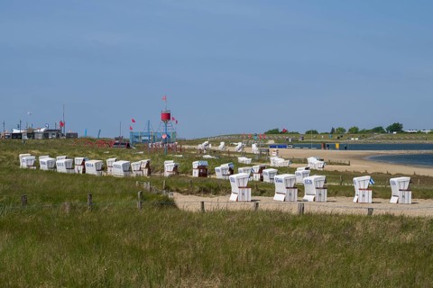 Beach chairs on the family lagoon, Perlebucht, Büsum, North Sea, Schleswig-Holstein, Germany