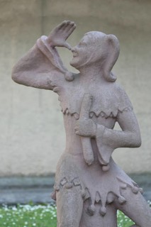 Sculpture of Till Eulenspiegel with gesture, thumb on nose, arm, high, up, hand, Bernburg,