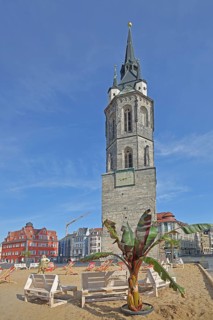 Red Tower with sandy beach, beach and palm tree, landmark, pedestrian zone, market square,