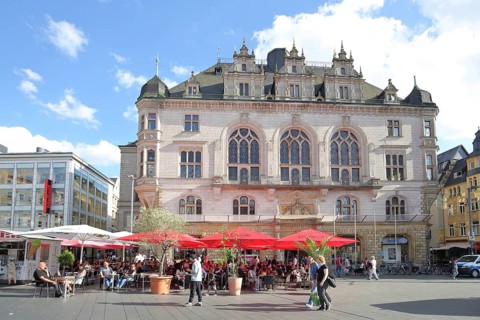 Neo-Gothic town house and street pub, with people and pedestrians, pedestrian zone, market square,
