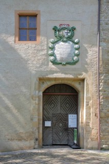Entrance with coat of arms to the castle and museum, Lützen, Saxony-Anhalt, Germany