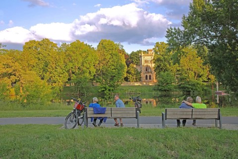 Christian Academy on the Saale and cyclist resting on a bench, leisure, relax, break, rest, enjoy,