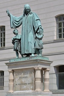Monument to theologian, pedagogue and poet, August Hermann Francke, man with two children, protect,