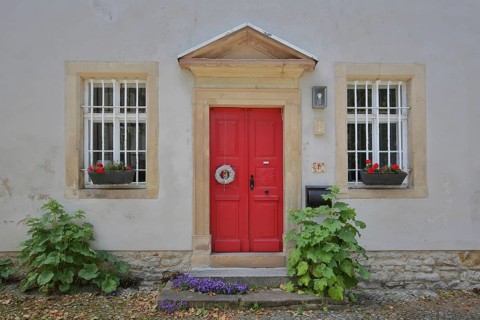 Red front door with floral decoration of the cathedral curia, idyll, two, window, plant growth,