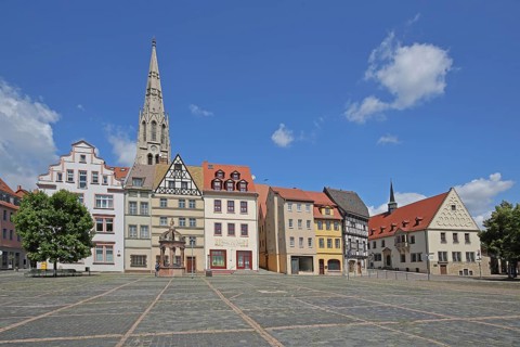Market square with historic houses, old town hall and steeple of St Maximi's Church, Merseburg,