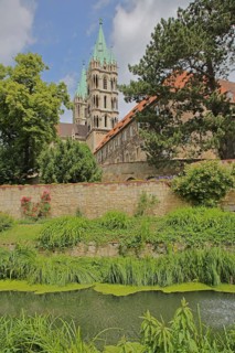 Late Romanesque UNESCO Cathedral of St Peter and St Paul with twin towers and cathedral garden,