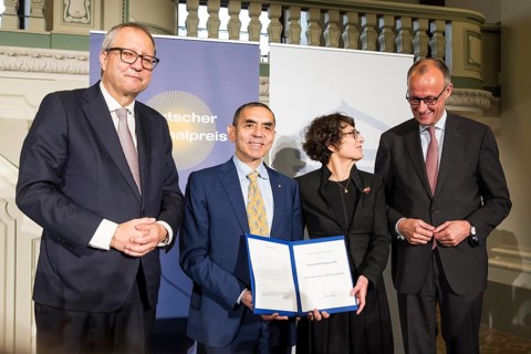 Thomas Mirow (Chairman of the Board of the German National Foundation), Ugur Sahin and Özlem Türeci