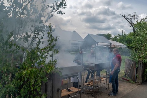 Heavy smoke at the sausage grill stations at the Backofenfest, Kleingeschaidt, Middle Franconia,
