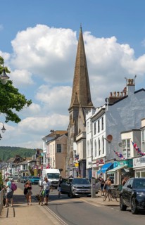Shops in street of historic buildings, The Strand, Dawlish, south Devon, England, UK