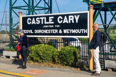 Railway station platform sign Castle Cary junction for Yeovil Dorchester and Weymouth, Somerset,