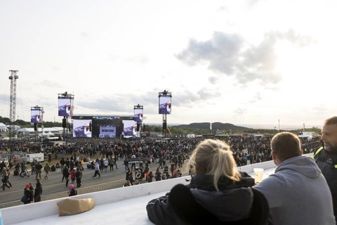 Festival-goers look at the Mandora Stage in the evening sun at the Rock am Ring Festival on Sunday,