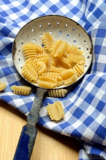 Italian pasta in a sieve, Radiatori variety