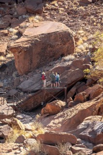 Tourists on a platform at the rock engravings of Twyfelfontein, Twyfelfontein, Kunene, Namibia