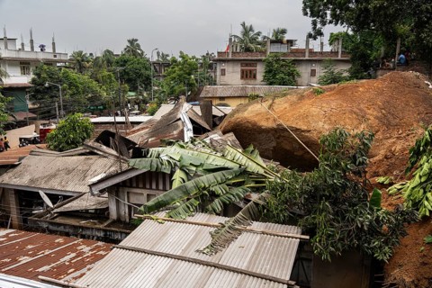 Damaged houses after a major landslide, triggered by a heavy downpour, in Guwahati, India, on June