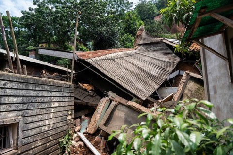 A damaged house after a major landslide, triggered by a heavy downpour, in Guwahati, India, on June