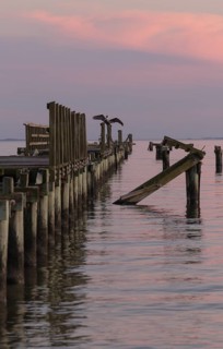 Dilapidated fishing pier damaged from hurricanes in Long Beach, Mississippi, USA