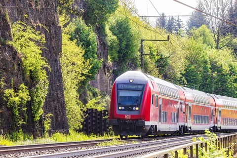 Regional express RE5 en route on the winding railway line of the Geislinger Steige. Landscape along