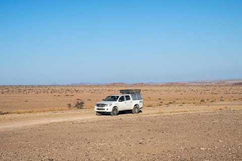 Off-road car on a sandy track, Brandberg, Damaraland, Namibia