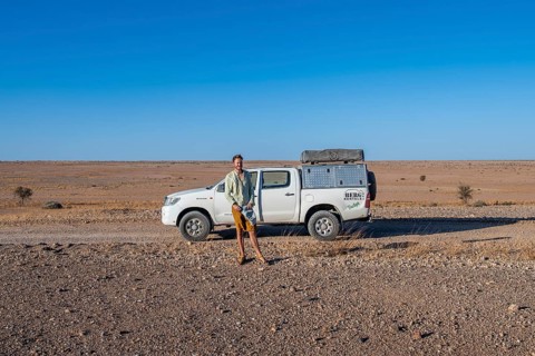 Tourist with off-road car on a sandy track, Brandberg, Damaraland, Namibia