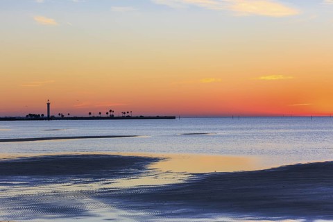 Sunrise silhouette of Broadwater Beach Marina Light at Biloxi, Mississippi, USA
