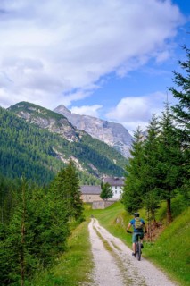 Cyclist on the railway cycle path, at the Rifugio Ospitale, Val Felizon, Cortina d'Ampezzo,