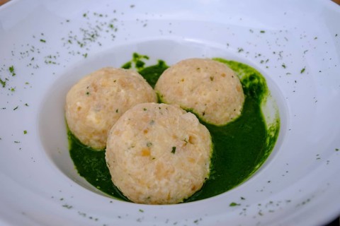 Dumplings on herbs, at Rifugio Ra Stua, Ra Stua Alm, Valon Scuro, near Cortina d'Ampezzo,