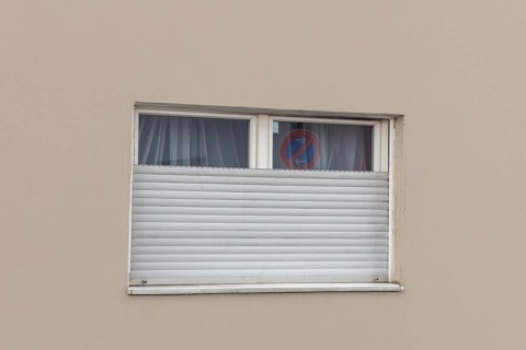 Broken roller shutter on a detached house