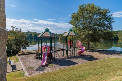Playground and swimming area in the Pin Oak Campground at Natchez Trace State Park near