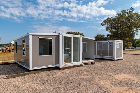 Foldable tiny house container kit home partially unfolded at Botel Campground near Savannah,