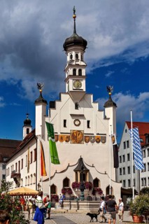 Baroque town hall with people, flags and dog in the foreground, The town of Kempten im Allgäu