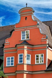 Orange-coloured baroque town house with decorative elements, The town of Kempten im Allgäu