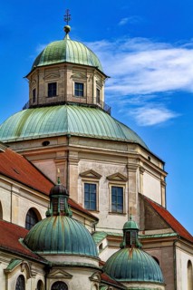 Baroque domes and tower in front of a blue sky with few clouds, The town of Kempten in the Allgäu