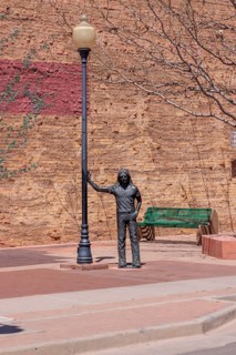 Statue of a man Standin' on a Corner in Winslow Arizona as sung in the classic Glenn Frey and