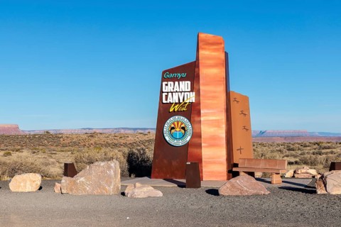 Sign at Grand Canyon West features seal of the Native American Halapai Tribe and welcomes visitors