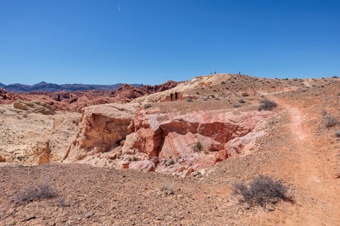 Hikers on the trail to an overlook at the end of Fire Canyon Road at Valley of Fire State Park near