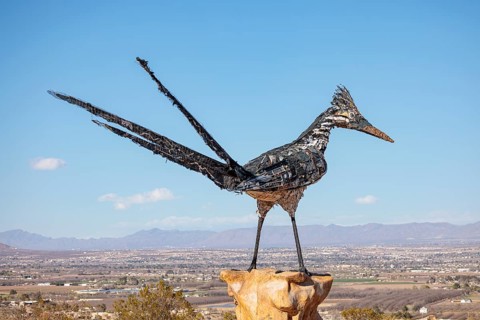 Giant Recycled Roadrunner statue made entirely from discarded materials by artist Olin Calk at an