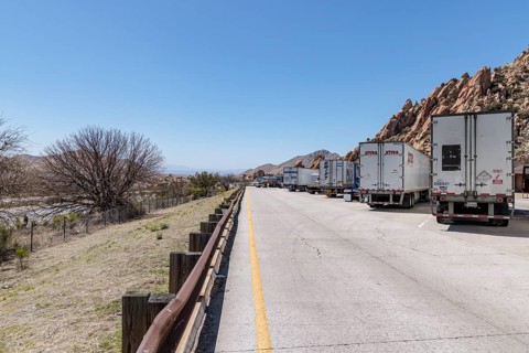 Semi trucks lined up at the Texas Canyon Rest Area on i-10 West near Dragoon, Arizona