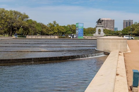 Bronze sculpture of Sam Houston behind the Mary Gibbs and Jesse H. Jones Reflection Pool at Hermann