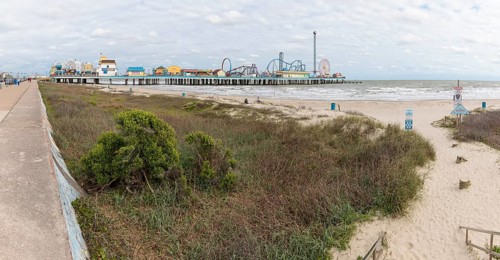 Sand beach near the Galveston Island Historic Pleasure Pier on the Texas Gulf Coast at Galveston,