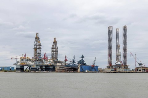 Drilling rigs docked for repairs in the Port of Galveston, Texas