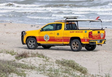 Galveston Island Beach Patrol truck on the beach of the Texas Gulf Coast at Galveston, Texas