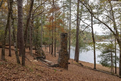 Fireplace chimney remains of a cabin used as a picnic site on the shore of Ivy Lake at Clarko State