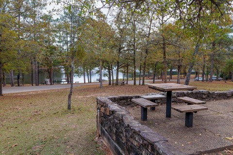 Picnic area overlooking Ivy Lake at Clarko State Park near Quitman, Mississippi, USA