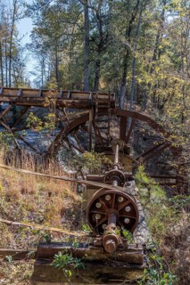 Hardware to convert energy from water wheel to gristmill and cotton mill at Dunn's Falls Park near