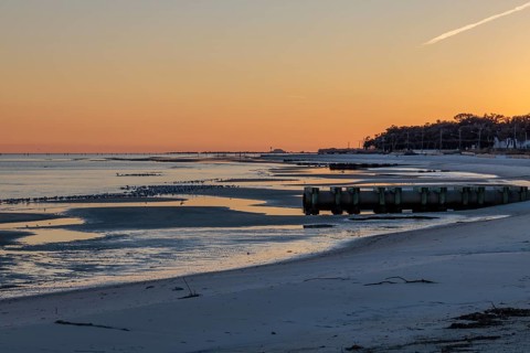 Sunset on the Mississippi Sound along the coastline of Long Beach, Mississippi, USA