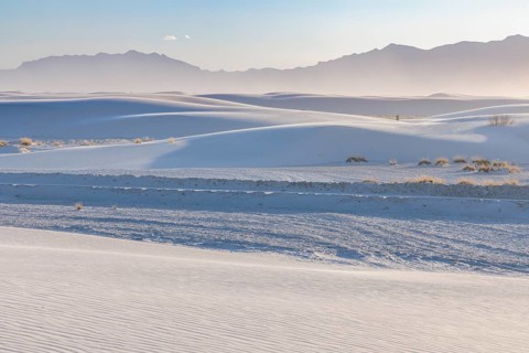 Dunes form smooth undulating curves and hills at White Sands National Park in Alamogordo, New