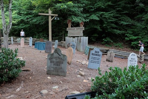 Funny headstones in the Lumberjack Graveyard at the Dollywood amusement park in Pigeon Forge, TN