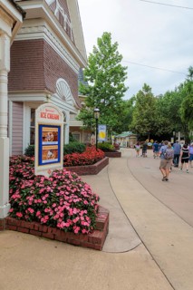 Sign for the Showstreet Ice Cream show surrounded by flowers at the Dollywood amusement park in