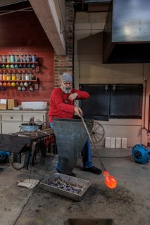 Glass blower demonstrates the art of blowing glass at the Dollywood amusement park in Pigeon Forge,